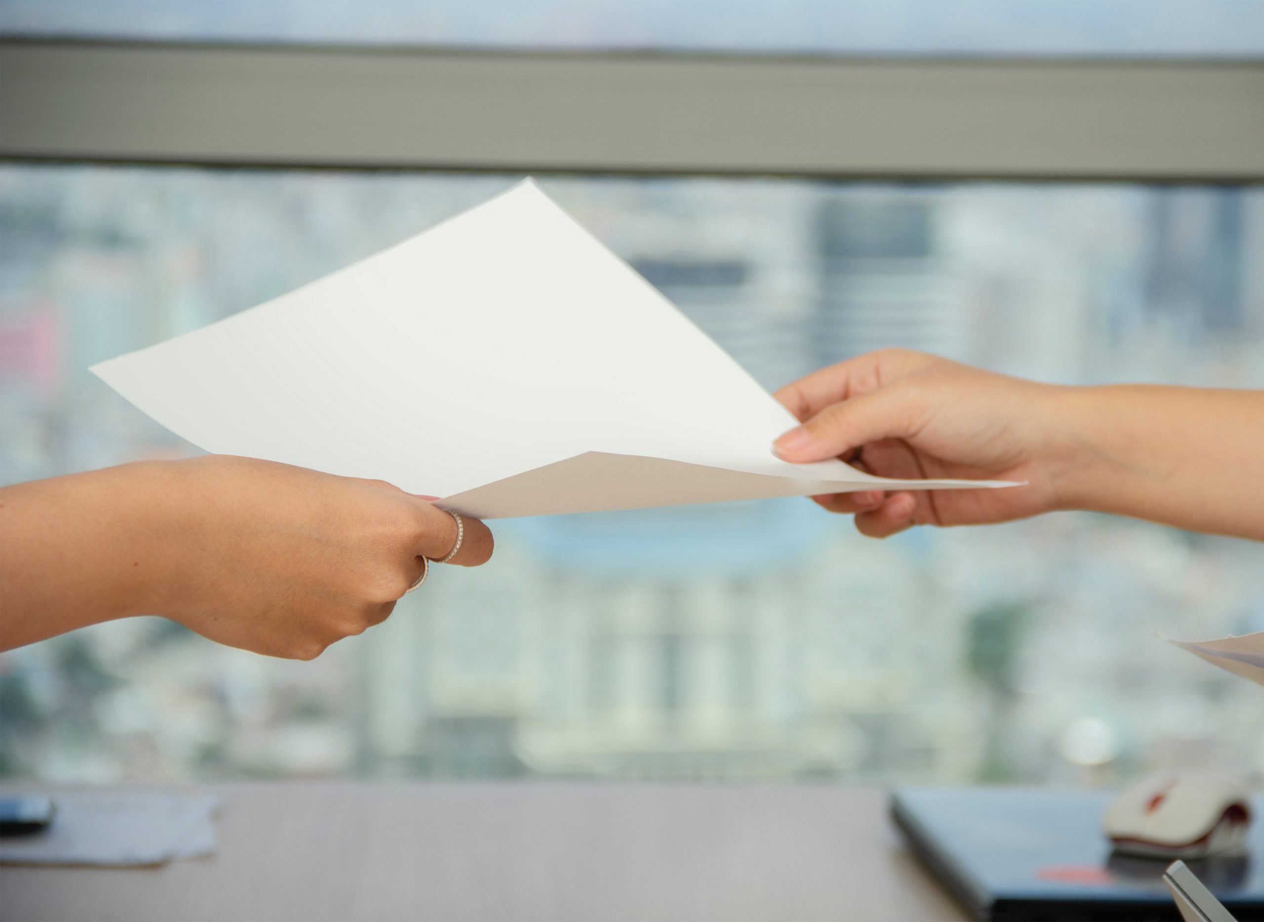 Picture of 2 hands holding a document